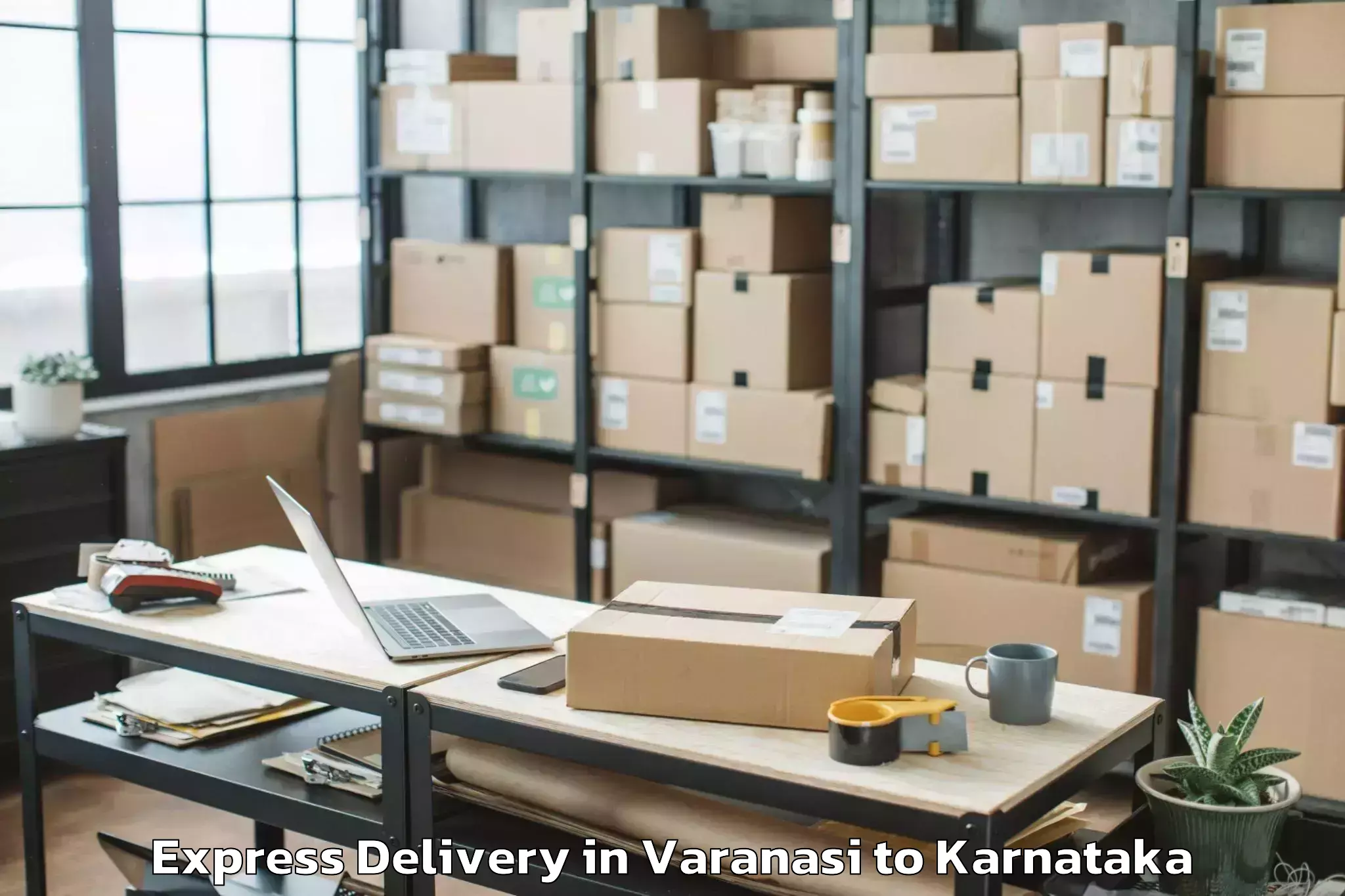 Reliable Varanasi to Karnataka State Law University Express Delivery